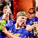 Time to celebrate: Craig Headley and his Chilton County teammates celebrated their area championship by showering each other with sparkling grape juice in the locker room.
