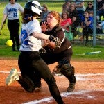 Too late to the plate: Chilton County’s Tiffany Crowson, right, couldn’t make a tag on Marbury’s Hannah Lee during Tuesday’s game.