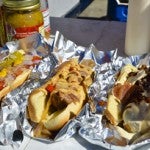 Ellison's Chicago dog, sausage dog and "Heart Stopper" dog are his specialties available at his hot dog stand.