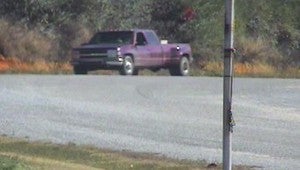 The suspect drove away in a maroon colored extended cab pickup truck (pictured) but covered his tag during the theft. 