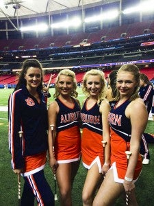 Heather Foshee (far left) and fellow Auburn University Majorettes stand in the Georgia Dome before the SEC Championship football game Dec. 7.