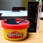 The explosive device was made out of a "Play-Doh" container rigged with fuses and filled with pyrotechnic powder and bird shot.