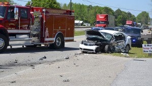 Authorities in Jemison worked the scene of a two-vehicle crash shortly after 1 p.m. Friday on U.S. Highway 31 in front of B Mart LLC.