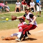 Verbena's Chelsea Ray slides safely into home plate before Maplesville's Alyssa McGee can apply a tag.