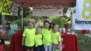 September is National Childhood Cancer month, and the girls decided to kick off the month by serving up lemonade to patrons visiting Peach Park.