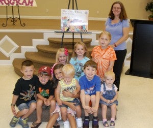 (Front row, left to right) Eastyn Worrells, Landon Lister, Lexi Lister, Rilyn Worrells, Dakota Gentry Brynlee Shaw, (back row) Kinzlee Price, Alexis Shaw and Jasmine Parsons participated in the Summer Reading Program. 