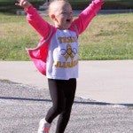 Home stretch: Cancer survivor Lilianna Thompson ran the one-mile “fun run” in last year's race. She was diagnosed with AML in August 2011. (Contributed)