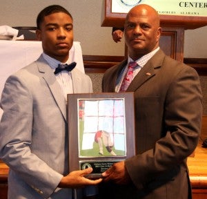 Maplesville junior running back Terence Dunlap (left) is presented the Class 1A Back of the Year award by Alabama High School Coaches and Athletic Directors Association Director Alvin Briggs on Wednesday in Montgomery. (Contributed)
