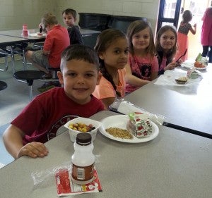Bradley Underwood, Sarah Green Elana Gore and Taylor Owens spent time eating breakfast at school last week.