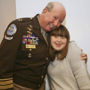 Chief Director General Gene Saunders, founder of Project Lifesaver (left) stands with Morgan Taft, 16, a Project Lifesaver client. (Contributed)