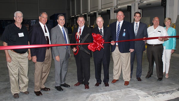Ribbon cutting: Merchants Foodservice held a ribbon cutting and open house Wednesday for the expansion to its distribution center in Clanton. Ribbon cutting participants included (from left) Billy Joe Driver, mayor of Clanton; Bobby Tatum, chairman of the Merchants Board of Directors; U.S. Rep. Gary Palmer, representing the Sixth Congressional District of Alabama; Andy Mercier, president and CEO; Donald Suber, retired president and CEO; Woody Cheatham, regional president; Vincent Perez, project manager with the Alabama Department of Commerce; State Rep. Jimmy Martin; and Janice Hull, director of the Chilton County Chamber of Commerce. (Photos by Joshua Wilson)