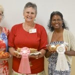 Sarah Saunders (left) took home first place in the Peach Cook-off on Saturday, while Patsy Ratliff grabbed second and Madeline Swindle wrapped up third place.