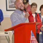 Brannon Burnett sings for those in attendance during a Veterans Day event at Senior Connection. 