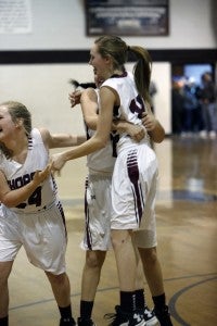 Lauren Wyatt, Lilly Barnett and Adi Argent share in the jubilation after Thorsby defeated Cleveland at home in the sub-regionals on Monday. (Photo by Brandon Sumrall / Special)